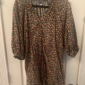 Floral blouse/dress that goes to the mid thigh in length.